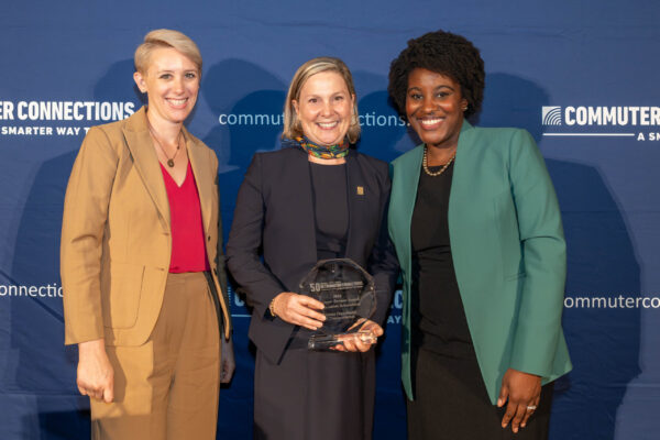 three people smiling